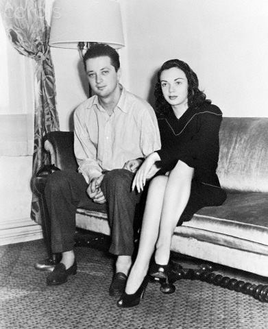 They are sitting on a couch.