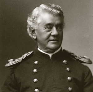 Photo of Captain Benteen. He has a boyish face 
but his hair is long and white.